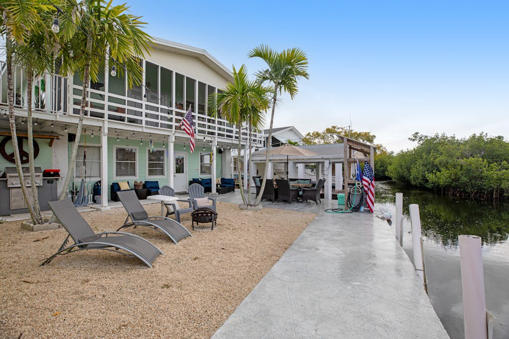 Canal-front Keys escape with amazing view, boat access, firepit, gril, AC, & W/D