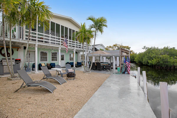 Canal-front Keys escape with amazing view, boat access, firepit, gril, AC, & W/D