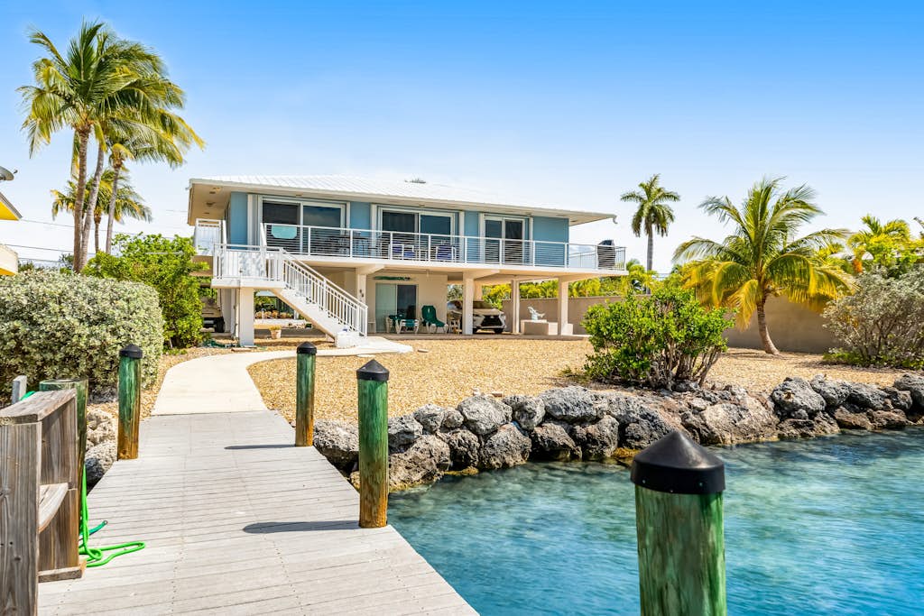 Dog-friendly beach escape with dock, furnished deck & bay views