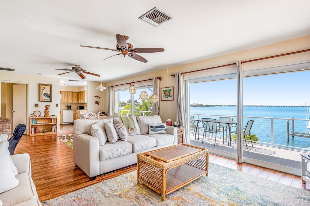 Dog-friendly beach escape with dock, furnished deck & bay views