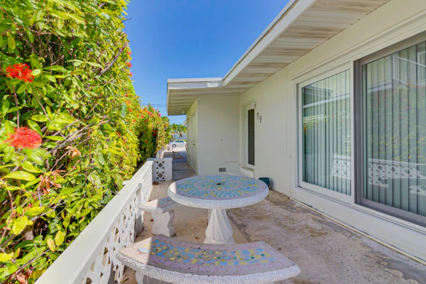 Waterfront home with 24-foot dock, shared pool, & beach access