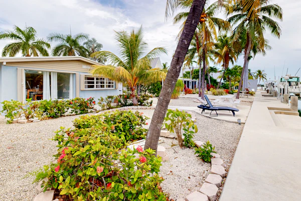Waterfront home with 60-ft dock, pool, & cabana club access - dog-friendly