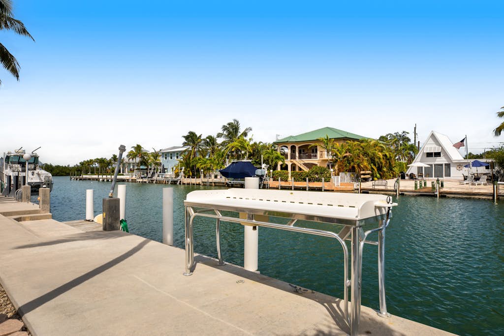 Waterfront home with 60-ft dock, pool, & cabana club access - dog-friendly