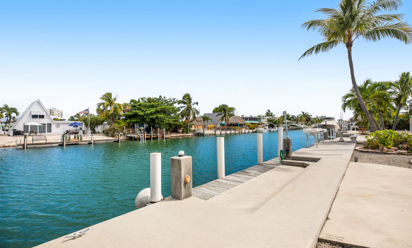 Waterfront home with 60-ft dock, pool, & cabana club access - dog-friendly