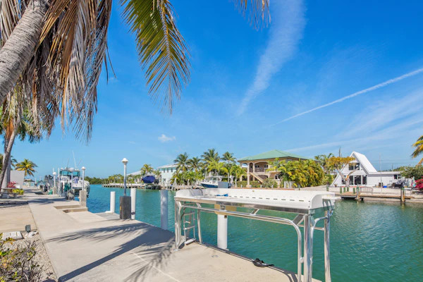 Waterfront home with 60-ft dock, pool, & cabana club access - dog-friendly