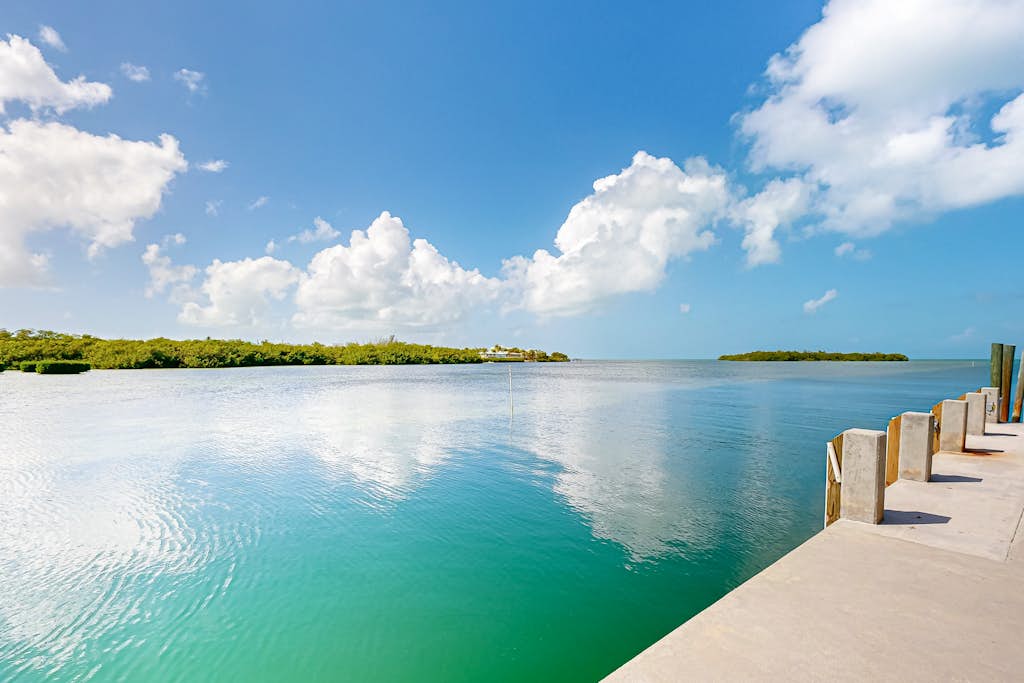 Luxurious waterfront home with panoramic views, pool, spa, & dock