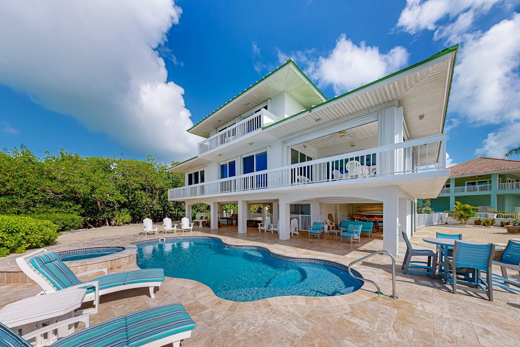 Luxurious waterfront home with panoramic views, pool, spa, & dock