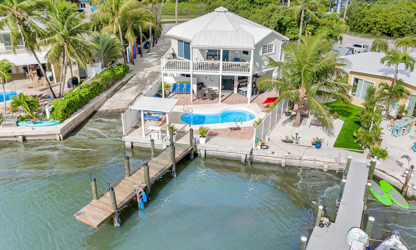Waterfront home with dock, pool table & private pool - walk to Sombrero Beach