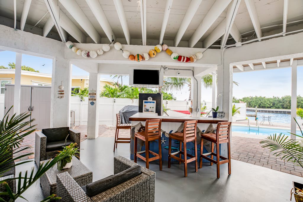 Waterfront home with dock, pool table & private pool - walk to Sombrero Beach