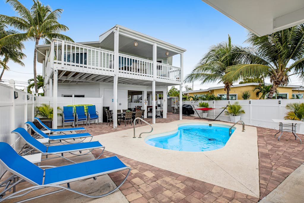 Waterfront home with dock, pool table & private pool - walk to Sombrero Beach