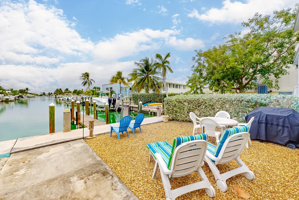 Canal-front duplex with Cabana Club membership, private dock, canal views, grill