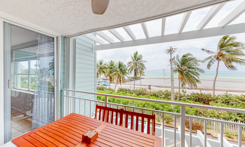 Colorful waterfront condo with pool & hot tub, AC, W/D, & WiFi