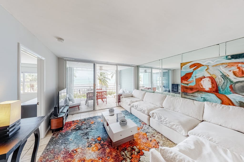 Colorful waterfront condo with pool & hot tub, AC, W/D, & WiFi
