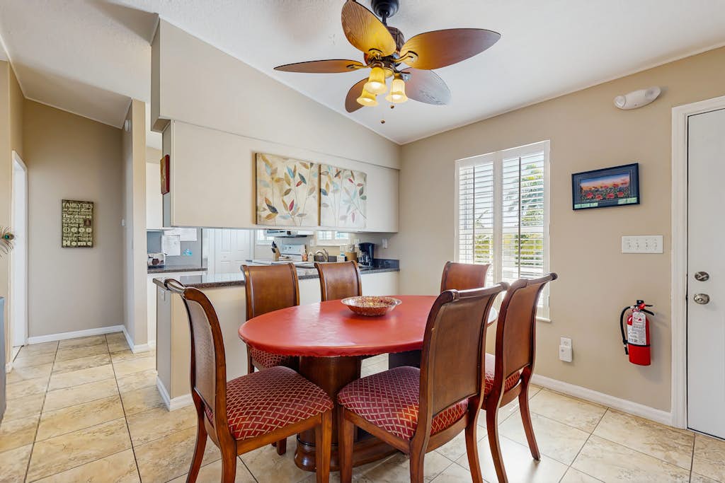 Canal front home w/ a dock, private pool, spacious deck, & easy water access