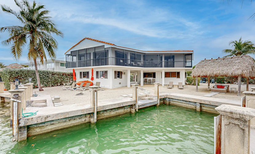 Waterfront jewel with private guest suite, boat slip, free WiFi, & washer/dryer