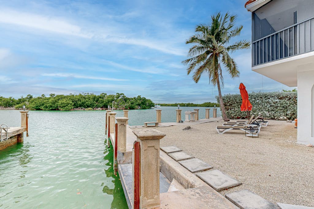 Waterfront jewel with private guest suite, boat slip, free WiFi, & washer/dryer