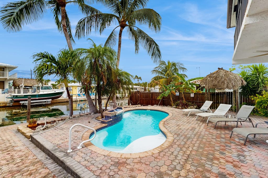 Waterfront house with covered patio, private pool, & 75' dock - dogs welcome