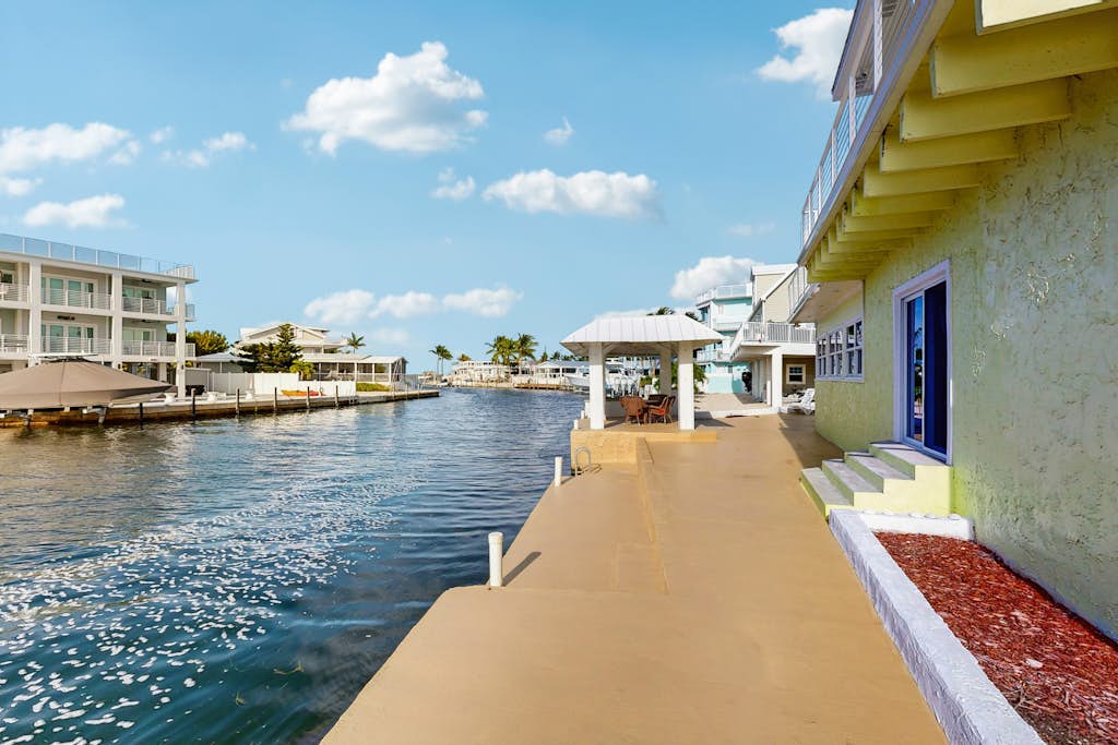 Canal Front Gem W/ Private Dock, PS4, Free WiFi, & Expansive Balcony W/ Views