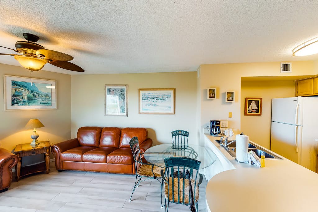 Coastal retreat with private balcony, pool, & easy beach access