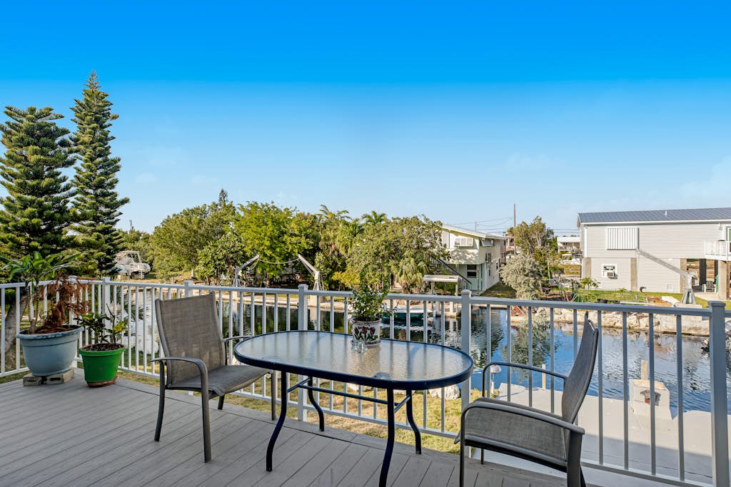 Beautiful waterfront home with central AC, dock, lovely balcony & patio