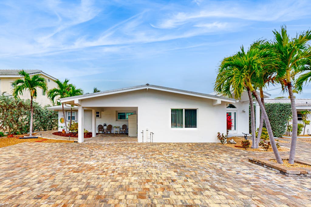 Waterfront Home with 35-Foot Dock and Access to Private Beach and Shared Pool