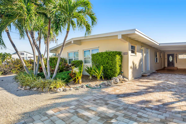 Deluxe canal-front home with pool, water-view patio, grill, & Cabana Club access