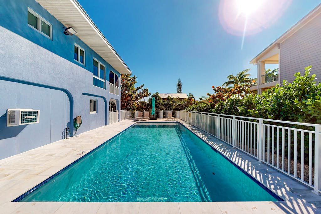 Pristine, updated retreat with private pool, screened deck, dock, & pool table
