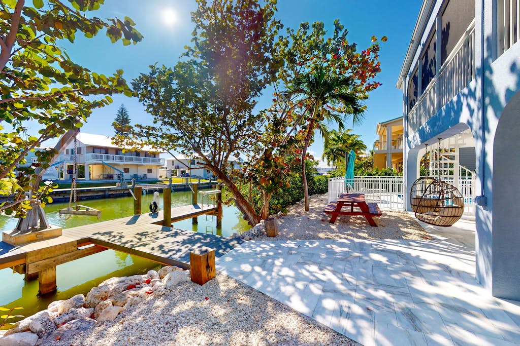 Pristine, updated retreat with private pool, screened deck, dock, & pool table