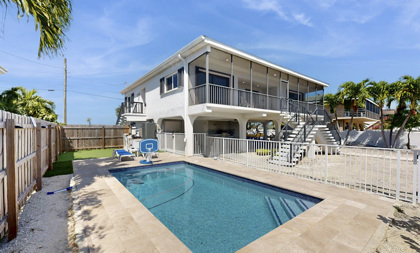 Serene retreat with private dock, pool, washer/dryer, & canal access