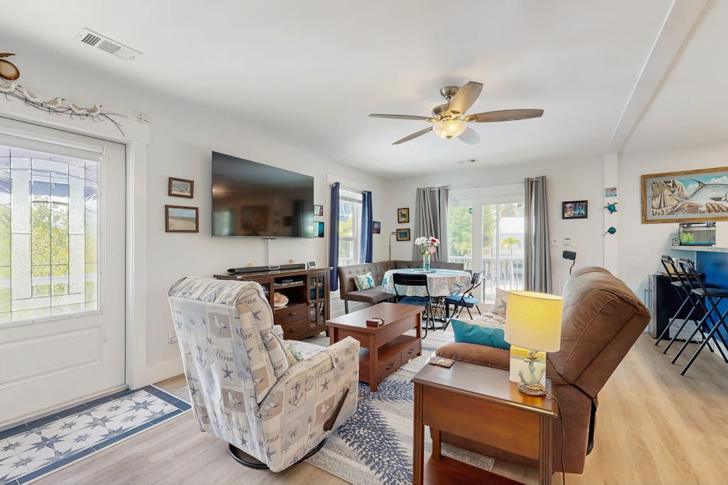 Coastal canalfront home with swim spa, dock, kayaks, e-bikes & dog friendly