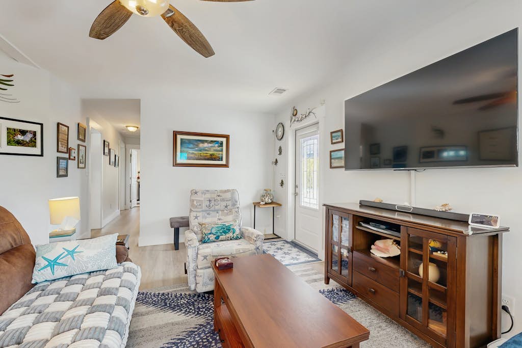 Coastal canalfront home with swim spa, dock, kayaks, e-bikes & dog friendly