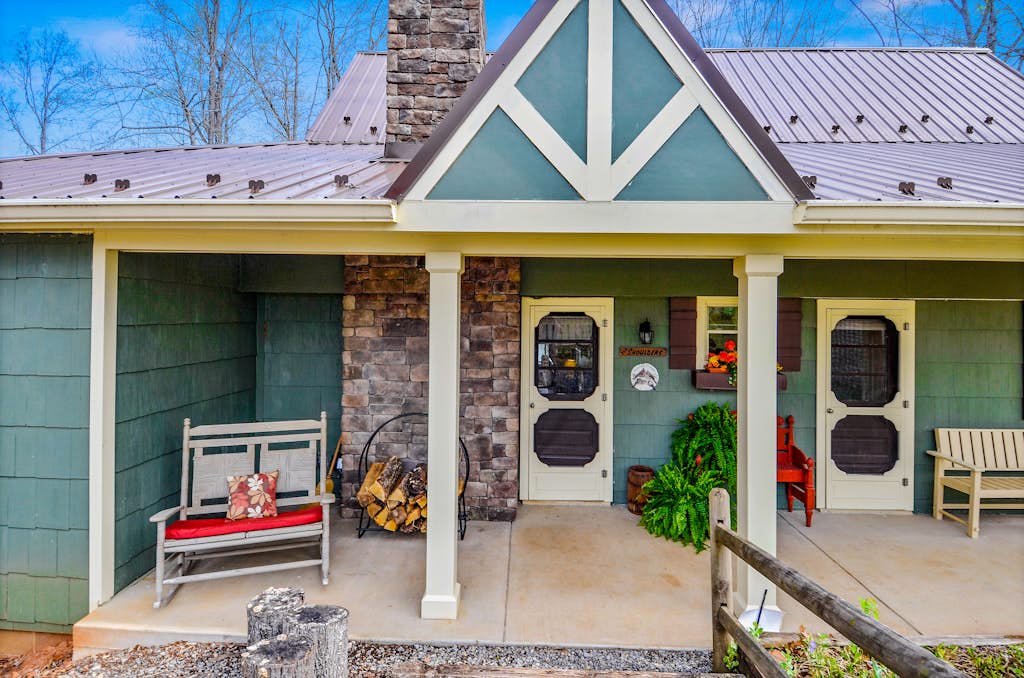 Waterfront lake-view home with dock, fireplace, pool table, kayaks, & firepit