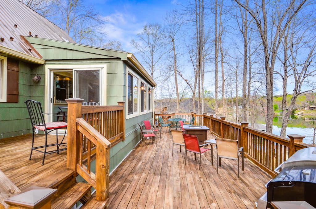 Waterfront lake-view home with dock, fireplace, pool table, kayaks, & firepit