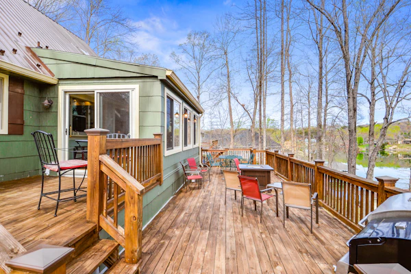 Waterfront lake-view home with dock, fireplace, pool table, kayaks, & firepit