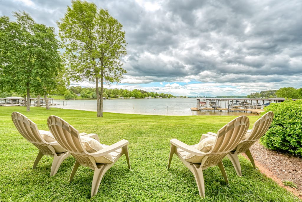 Sunset Cove - Waterways lakefront retreat with boat slip, pool & beach - dogs OK