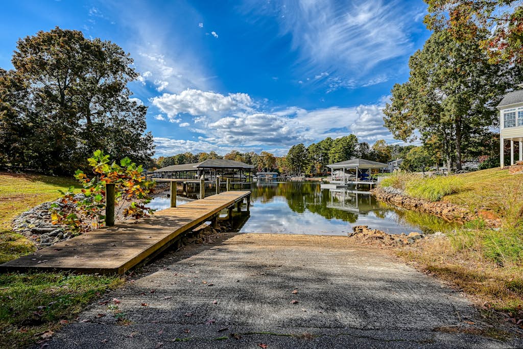 Great home with powered dock, boat launch, outdoor pool, & beach