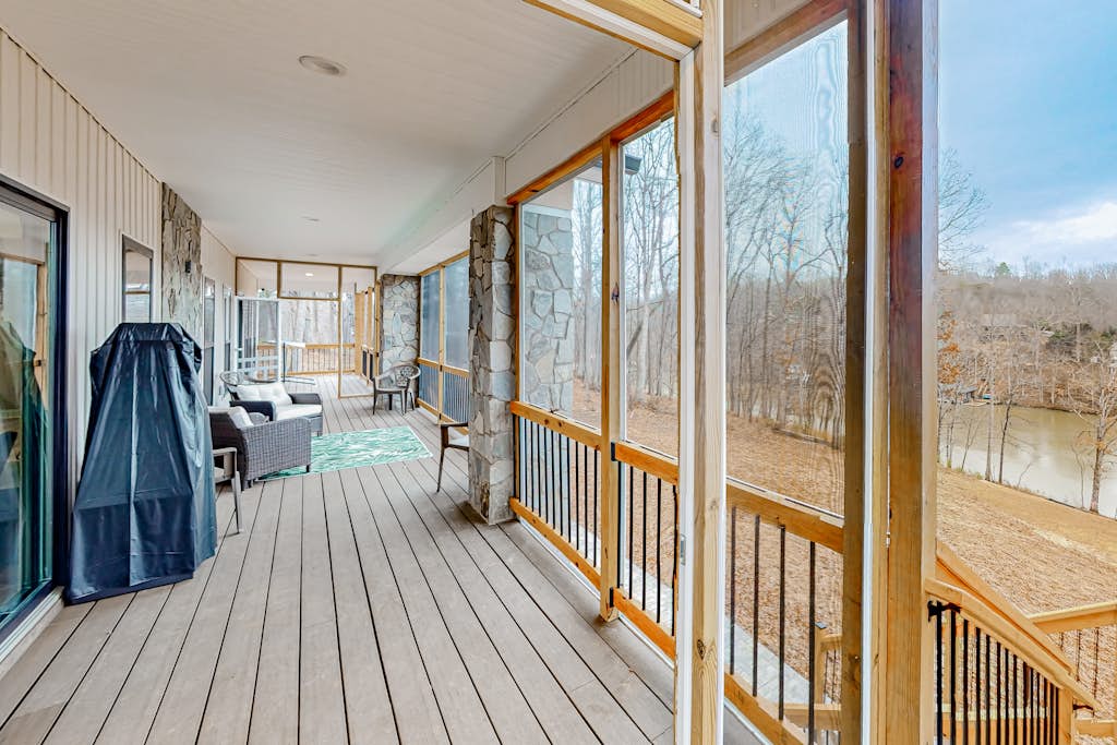 Stunning lakefront oasis with a kayak, large deck, games, & tranquil views