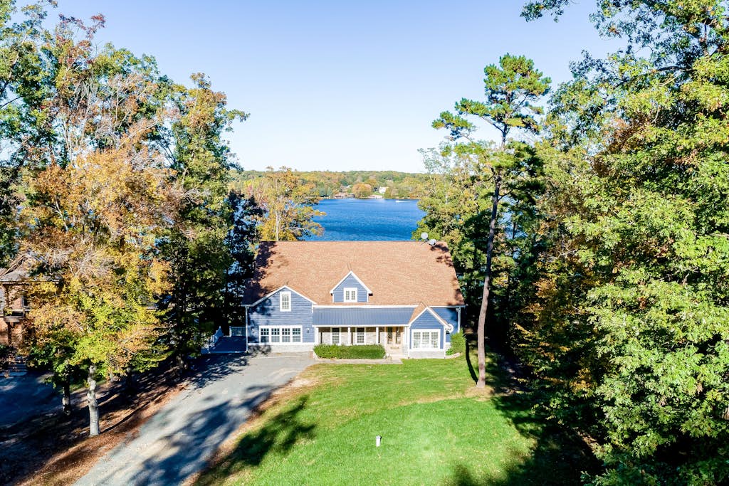 Lakefront home with private hot tub, WiFi, fun rec room, & beach area