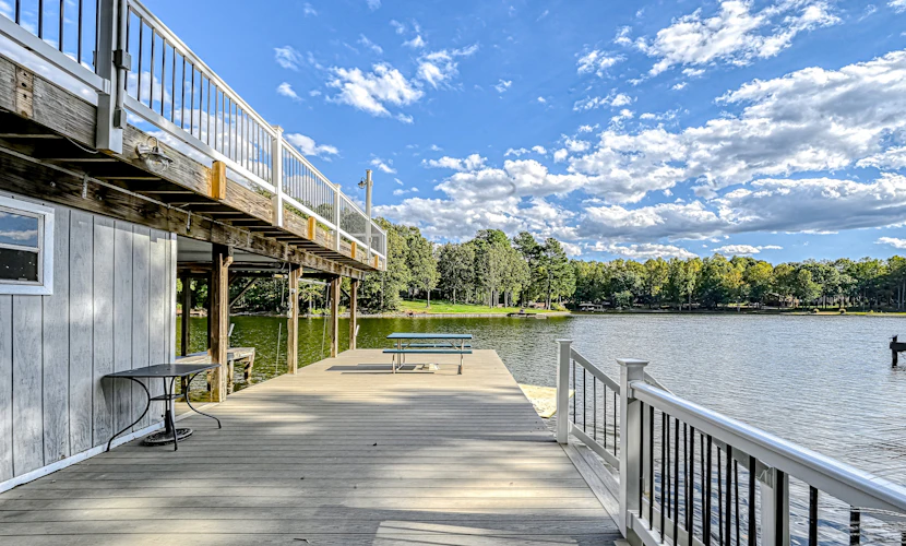 Lakefront family home in gated community with swimming area & dock - dogs OK