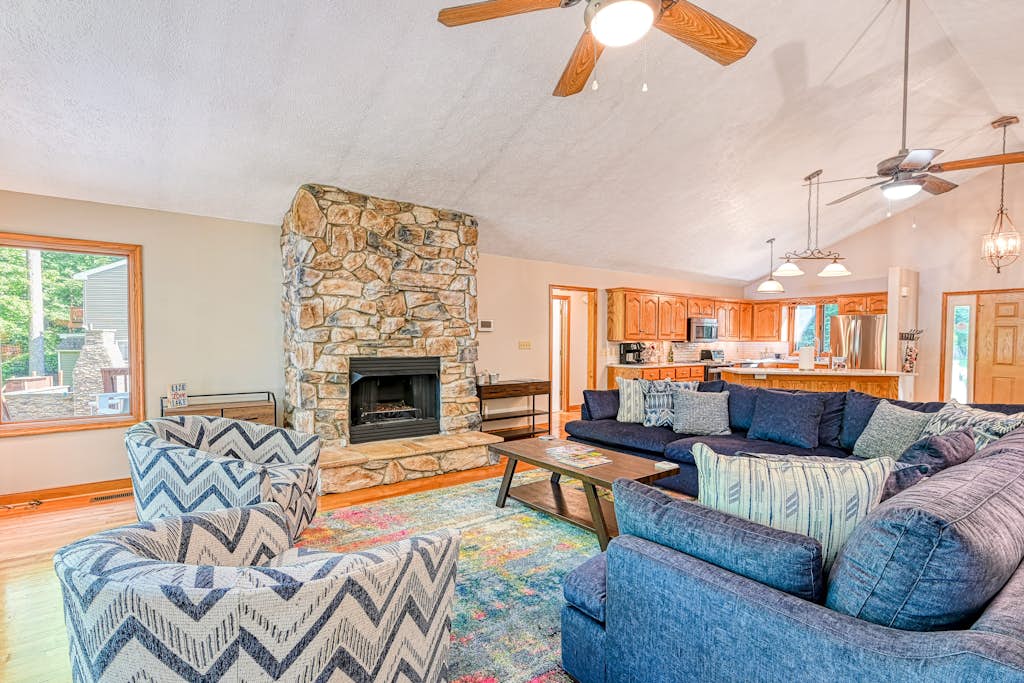 Lakefront home with deck, hot tub, game room, kayaks, & fireplace