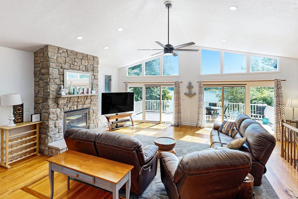 Lakefront home with two kitchens, a dock, firepit, & pontoon