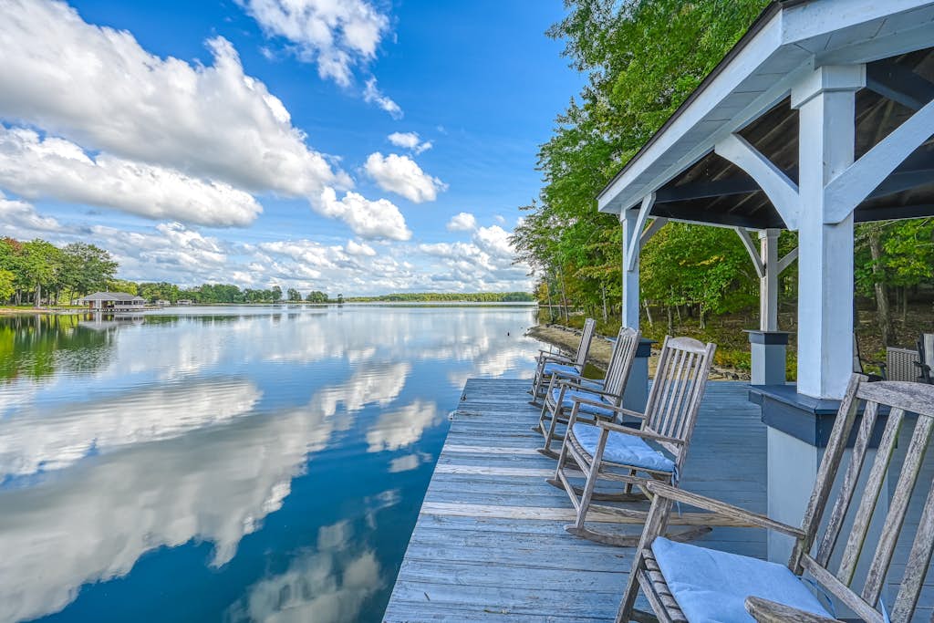 Stunning lakeside home with dock, large deck, kayaks, firepit, & pool table