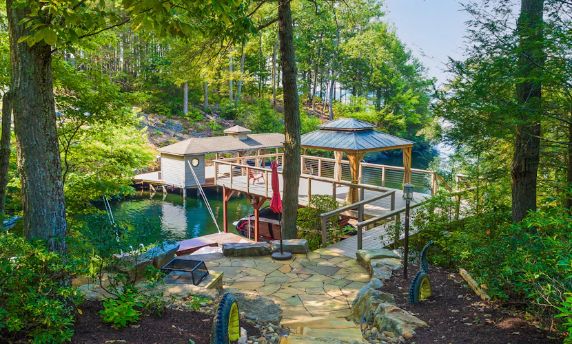 Lakefront home with granite counters, fireplace, lake views, & dock