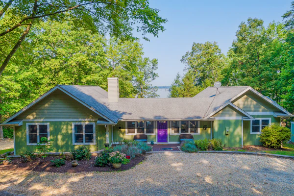 Lakefront home with granite counters, fireplace, lake views, & dock