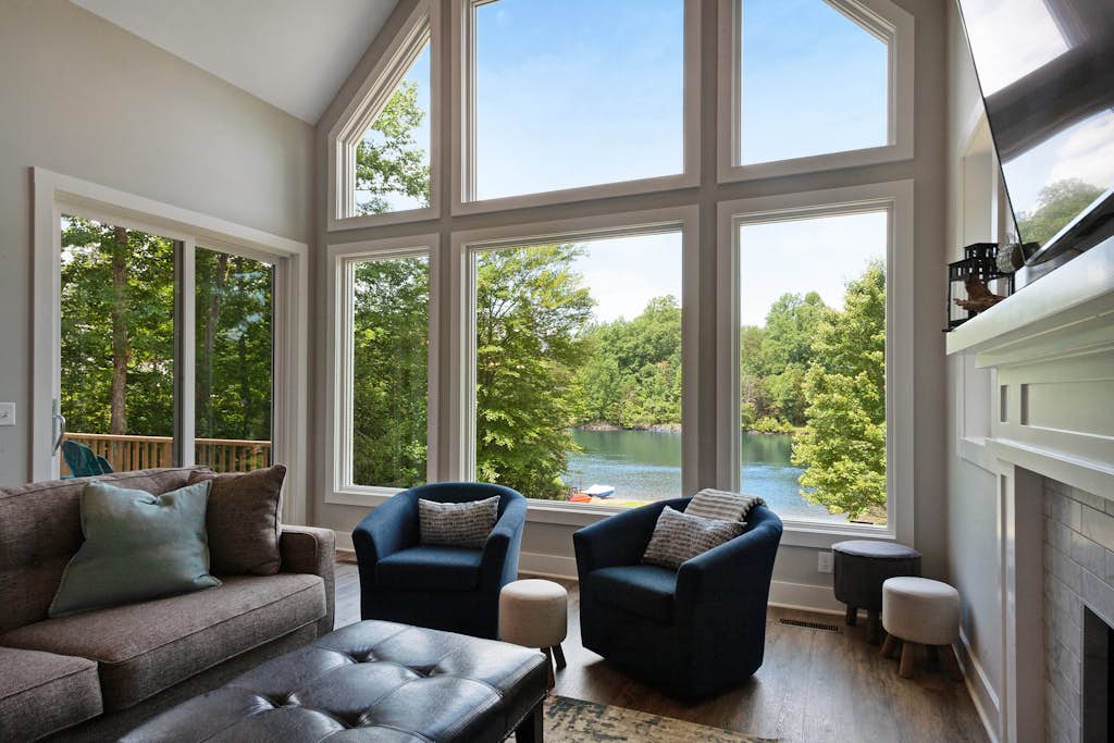 Custom lakefront home with private beach, dock & firepit