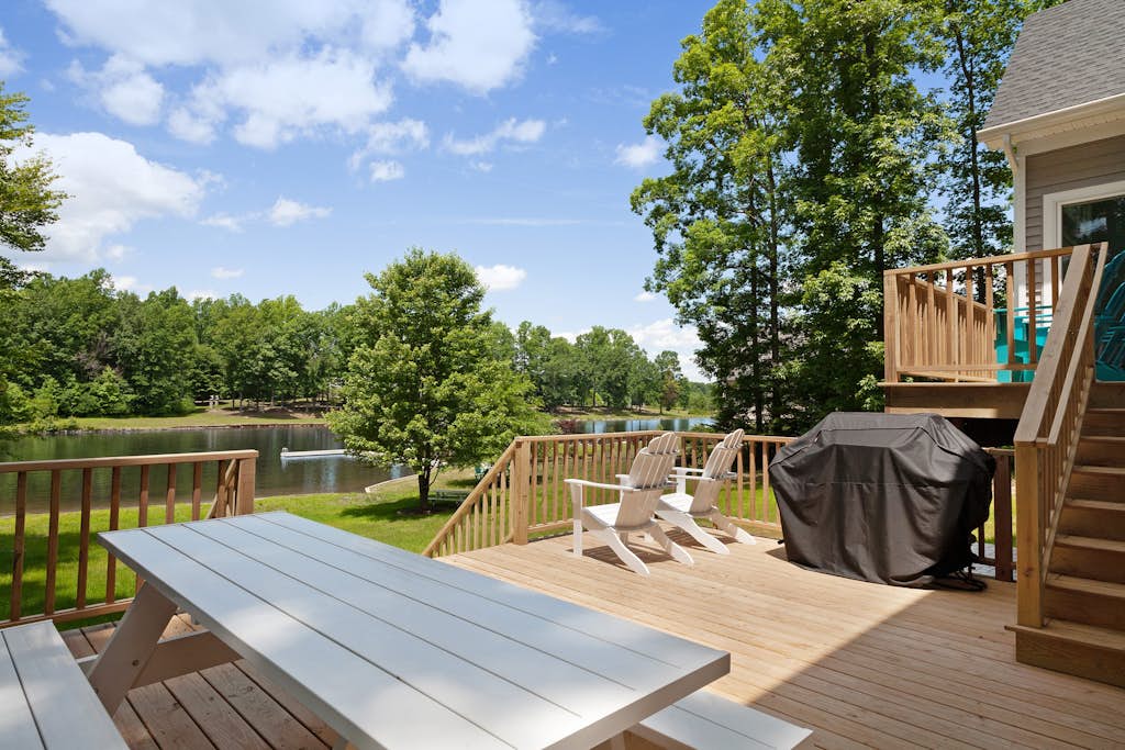 Custom lakefront home with private beach, dock & firepit