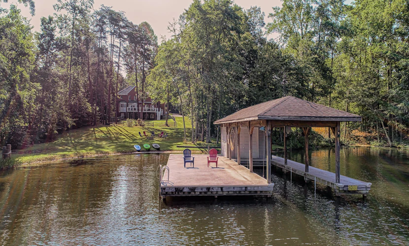 Lakefront home with boat dock, private firepit & game room - dog-friendly
