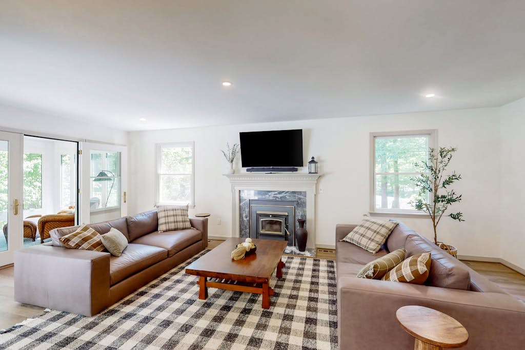 Stunning lakefront retreat w/firepit, game room, & water views