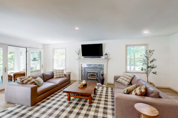 Stunning lakefront retreat w/firepit, game room, & water views