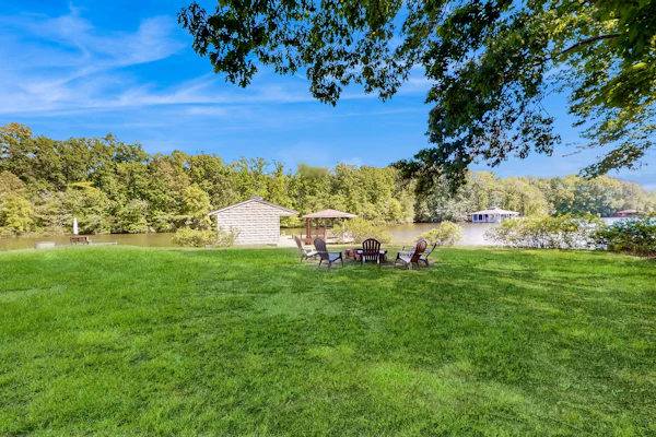 Stunning lakefront retreat w/firepit, game room, & water views